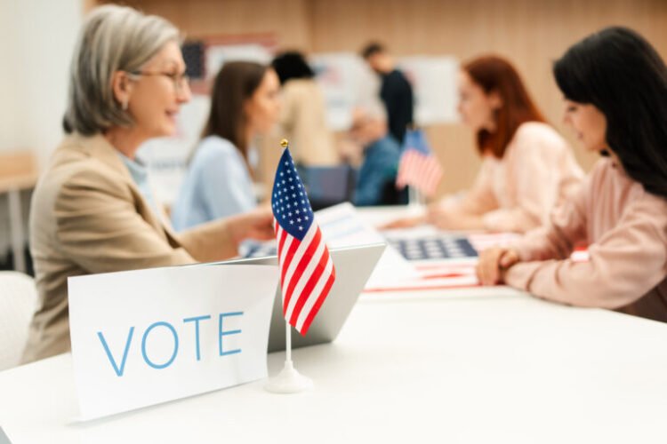 group of us citizens performing civic responsibility and voting at polling station