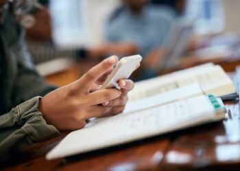 hands school university with phone research reading message mobile app classroom student college social media with education learning scroll news story with technology