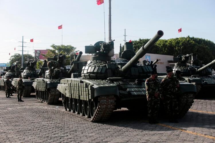 Members of the Nicaraguan Army prepare their tanks to march before a military parade to commemorate the 43rd anniversary of the founding of the Nicaraguan Army in Managua, on September 3, 2022. (Photo by OSWALDO RIVAS / AFP)